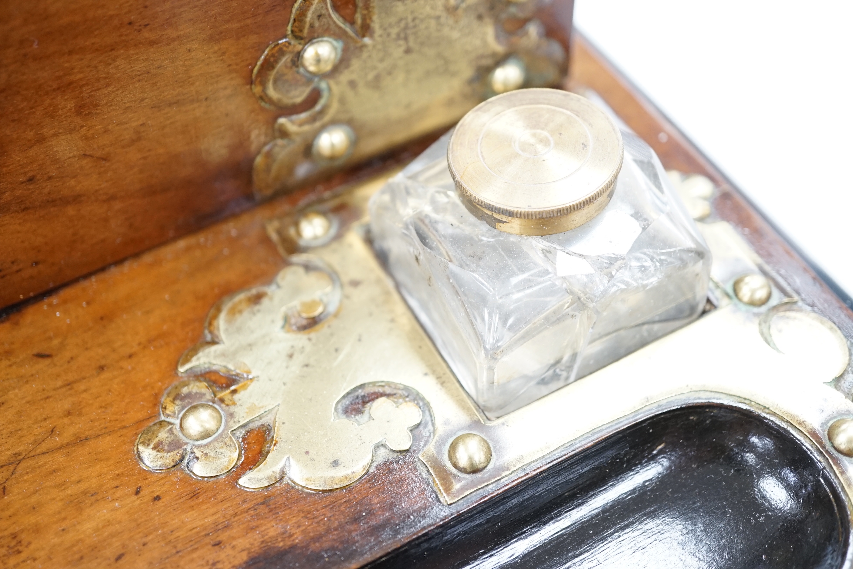 A Victorian walnut brass mounted dome topped stationery box and ink stand and an oval oak and a brass two handled tray, stationery box 25cm high